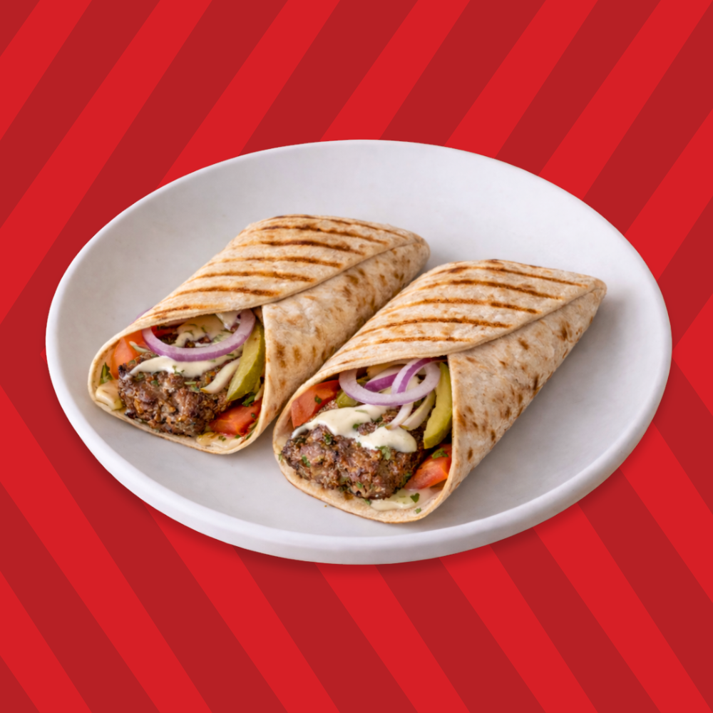 Adana spicy kebab wrap with spicy kebab filling and fresh toppings