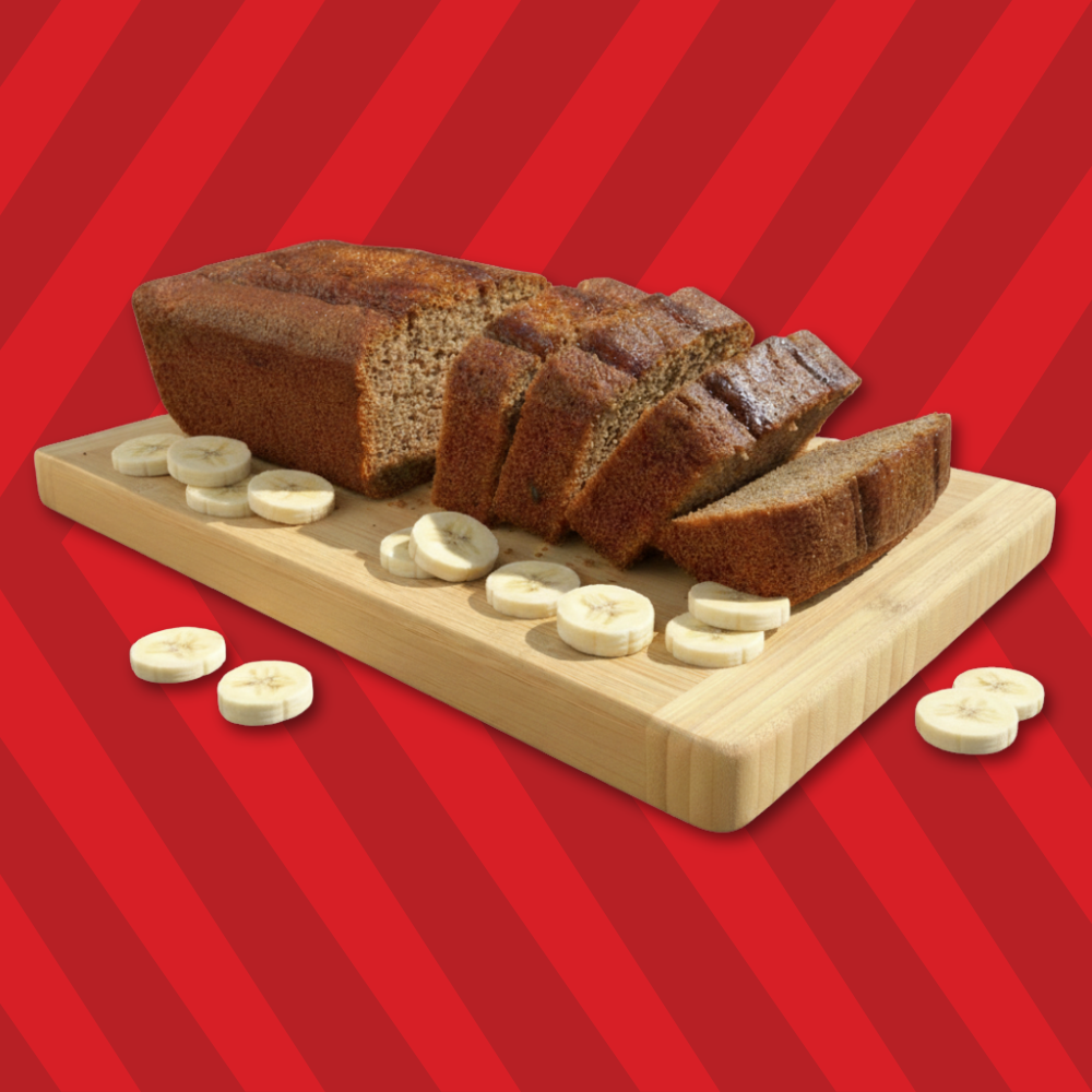Banana Bread on a wooden board with beautifully decorated with banana pieces.