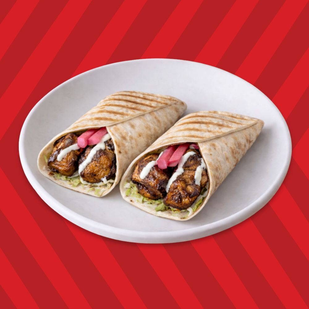Beef kebab wrap with onions, pickles and sauce