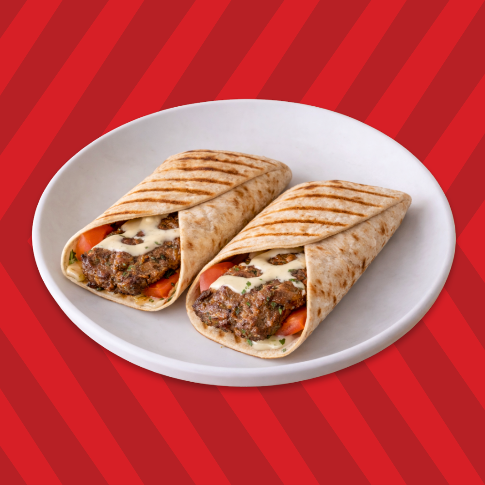 Beef kefta kebab wrap with seasoned meat and toppings