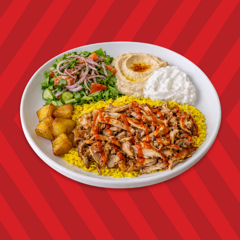 Chicken shawarma plate with rice, salad, hummus and garlic sauce