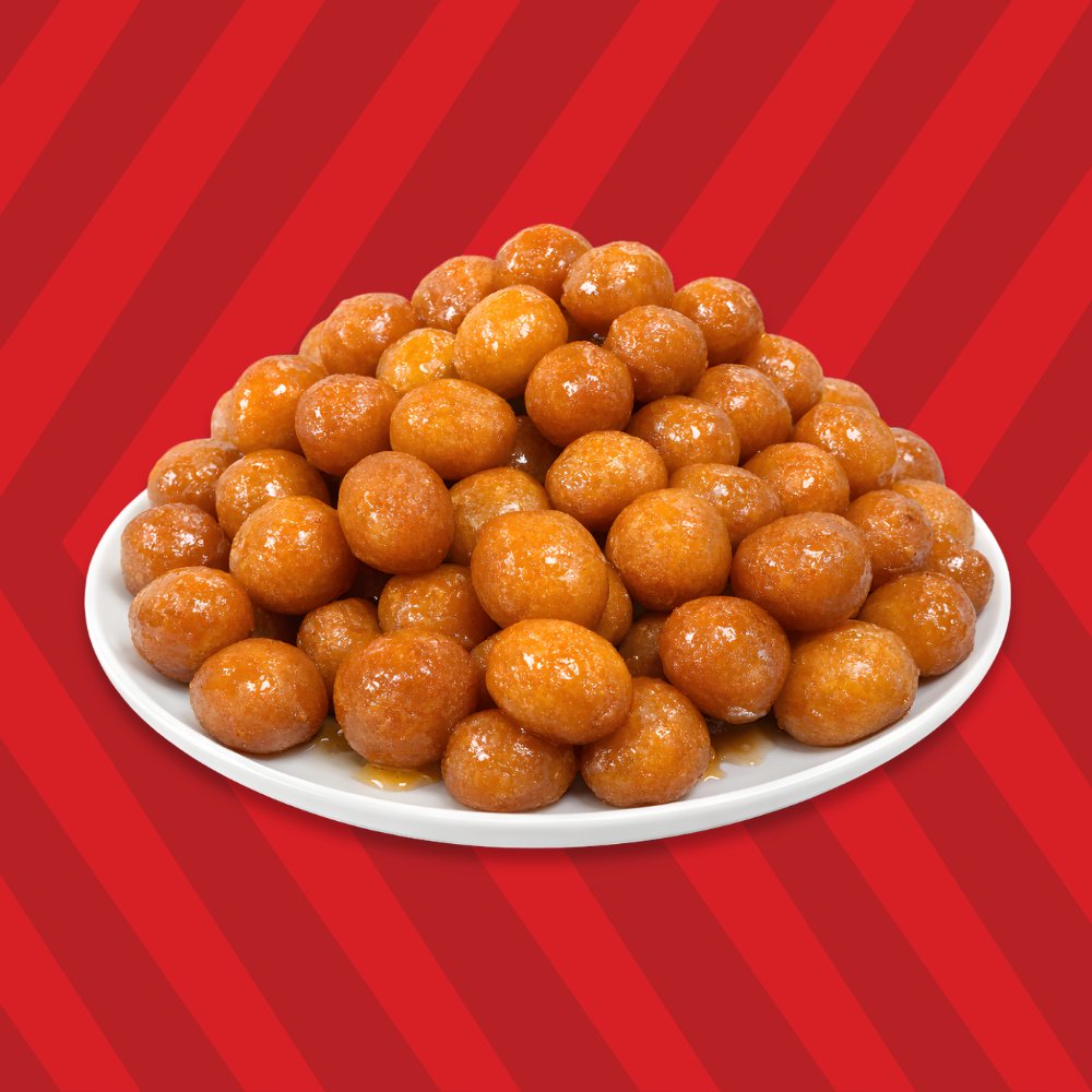 Middle Eastern fried golden honeyballs awameh soaked in syrup.