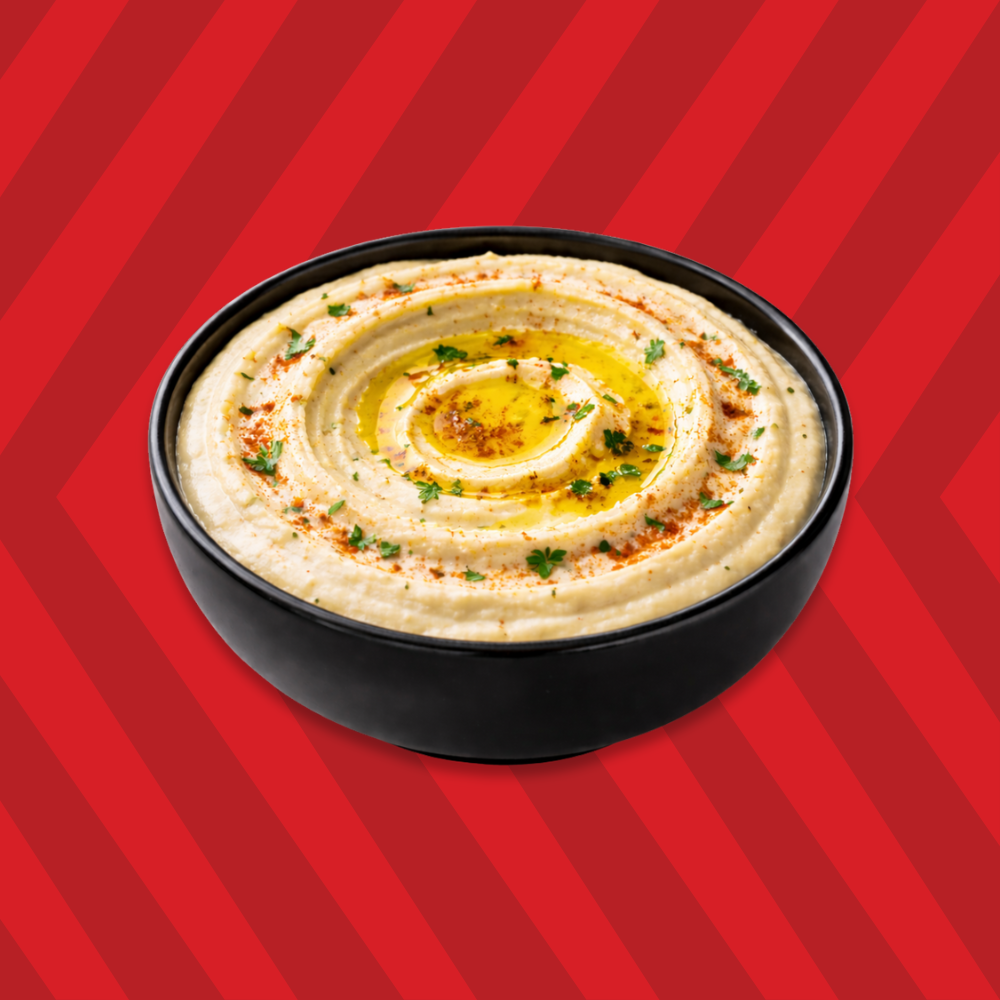 Hummus dip topped with olive oil and spices