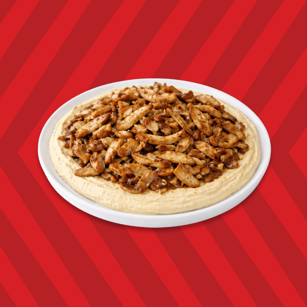 Hummus topped with chicken pieces