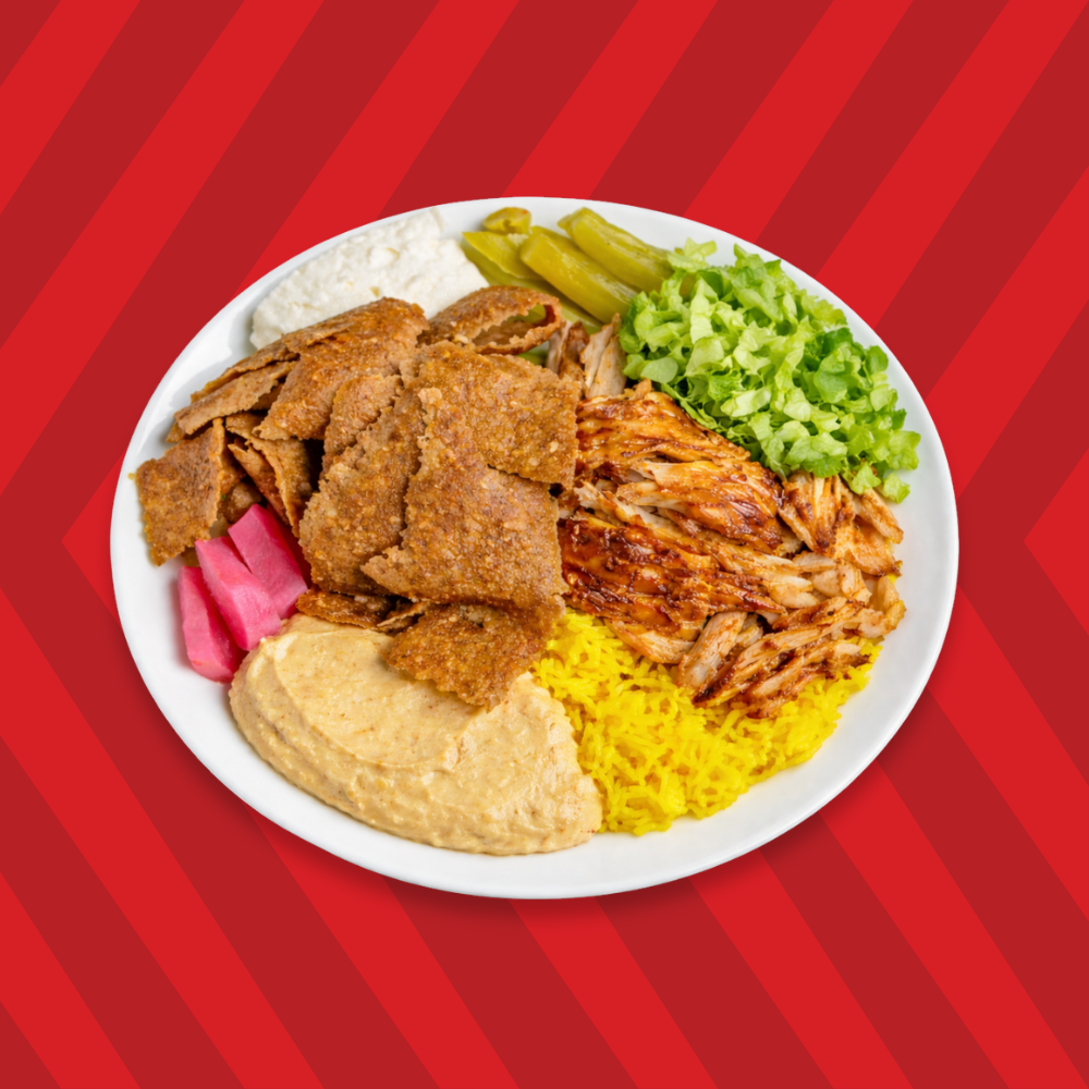 Plated meal with rice, meat, and vegetables on a red striped background