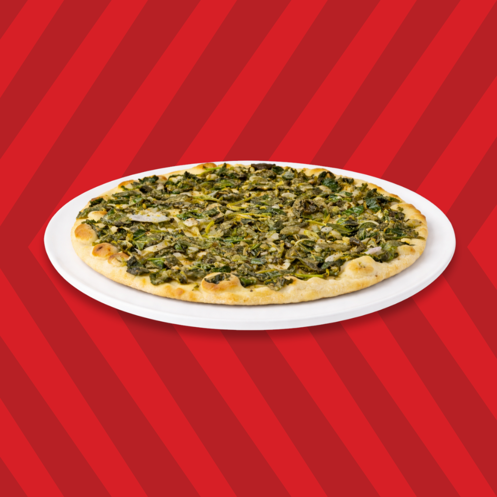 Basha spinach pie topped with fresh spinach mixture