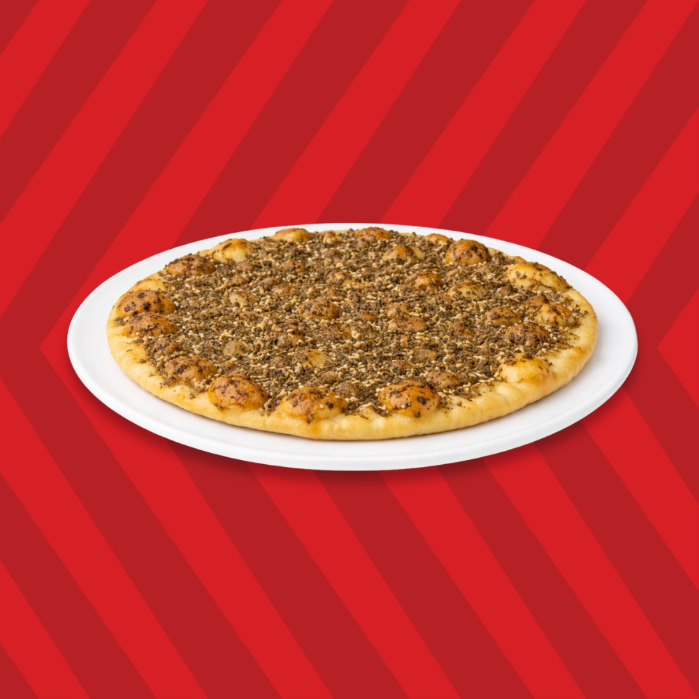 Basha zaatar pie topped with zaatar seasoning