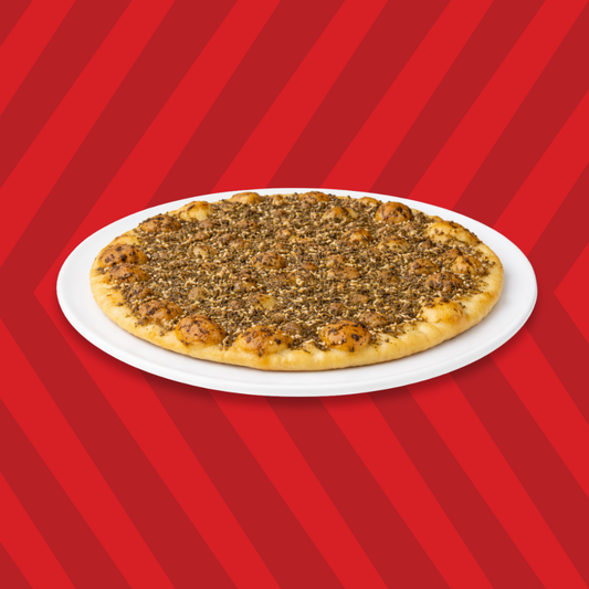 Basha zaatar pie topped with zaatar seasoning